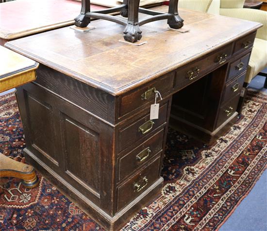 A late Victorian oak pedestal desk W.136cm